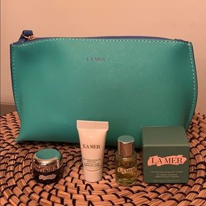 La Mer pouch with La Mer traveling size products